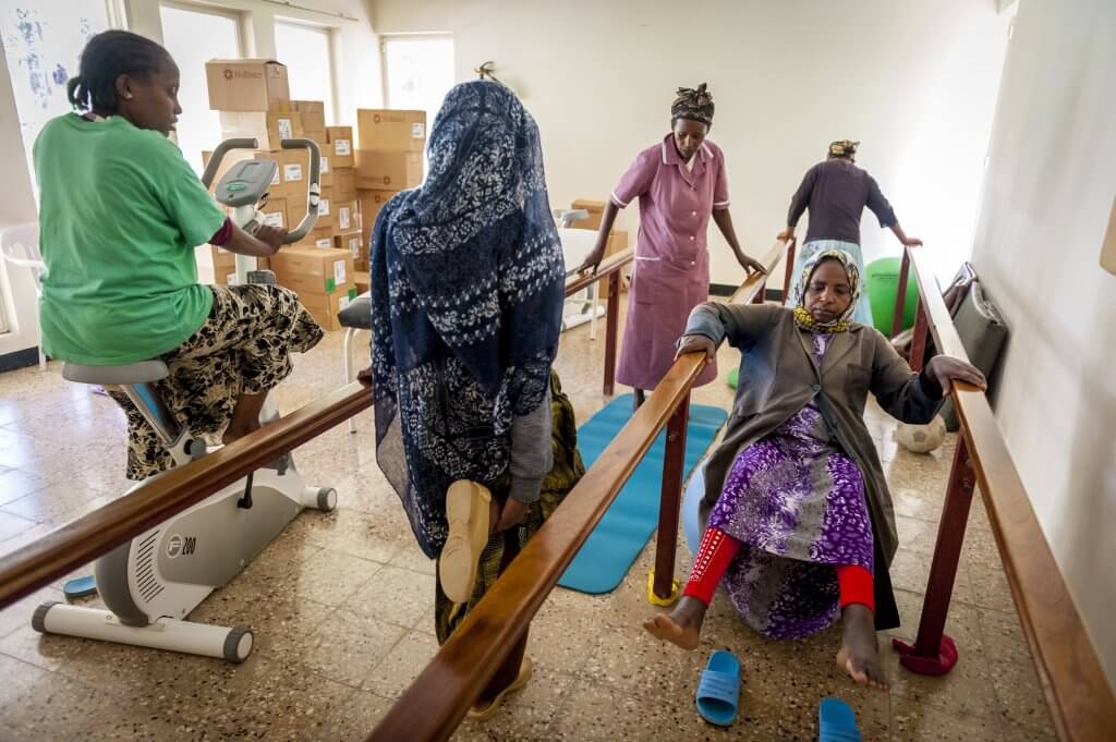 Residents of Desta Mender work out in the physical therapy room.